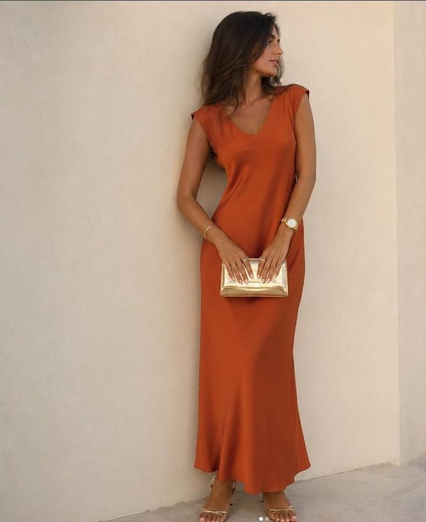 Model in a fitted rust-orange dress, Watermellon Concept Store