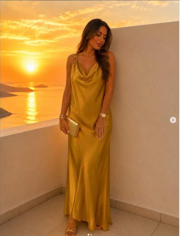 Model in a gold satin dress at sunset, Watermellon Concept Store